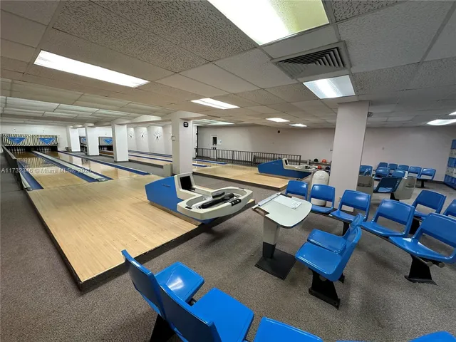 a view of a patio with table and chairs