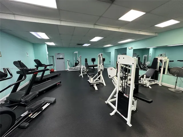 a living room with lots of furniture and a rug