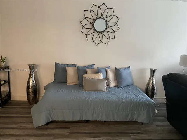 a large bed in a white room