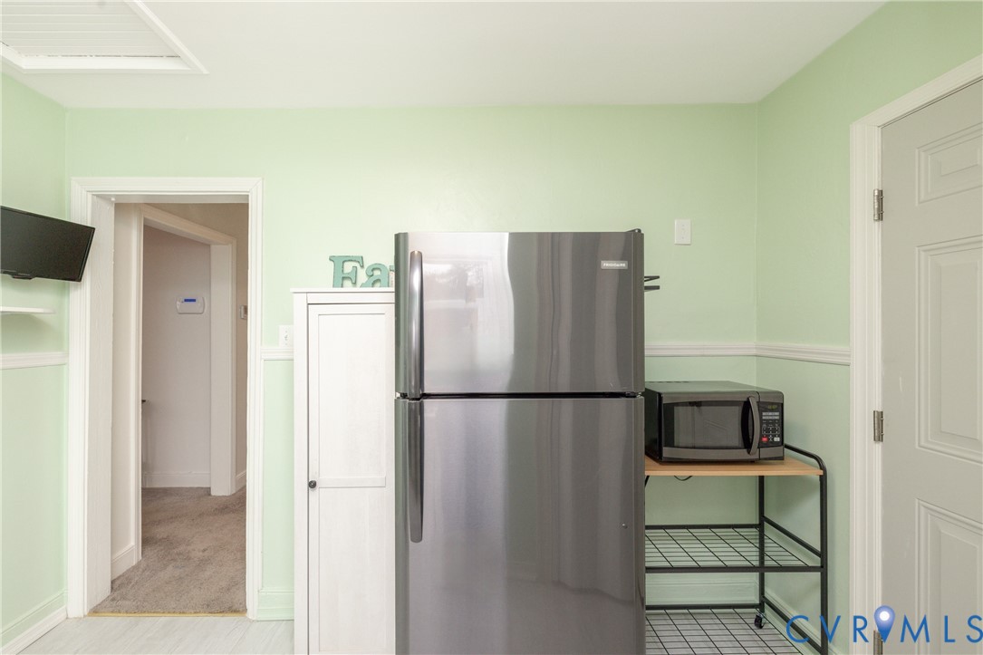 2904 Bethlehem Road Henrico, VA 23228 - Photo 11 of 22 a white refrigerator freezer and a stove sitting inside of a kitchen