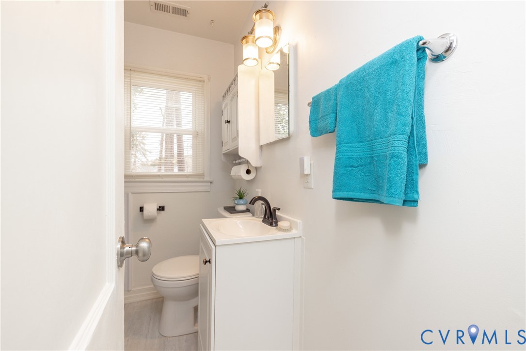 2904 Bethlehem Road Henrico, VA 23228 - Photo 17 of 22 a bathroom with a sink vanity mirror and toilet