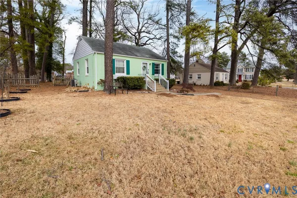 a view of house with trees in the background