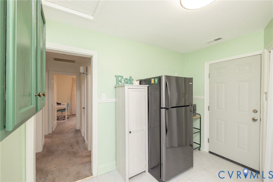 2904 Bethlehem Road Henrico, VA 23228 - Photo 10 of 22 a view of kitchen with refrigerator cabinet and windows