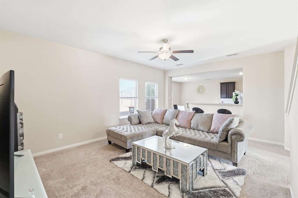 227 Curt Street Anna, TX 75409 - Photo 7 of 40 Living room featuring light carpet and ceiling fan