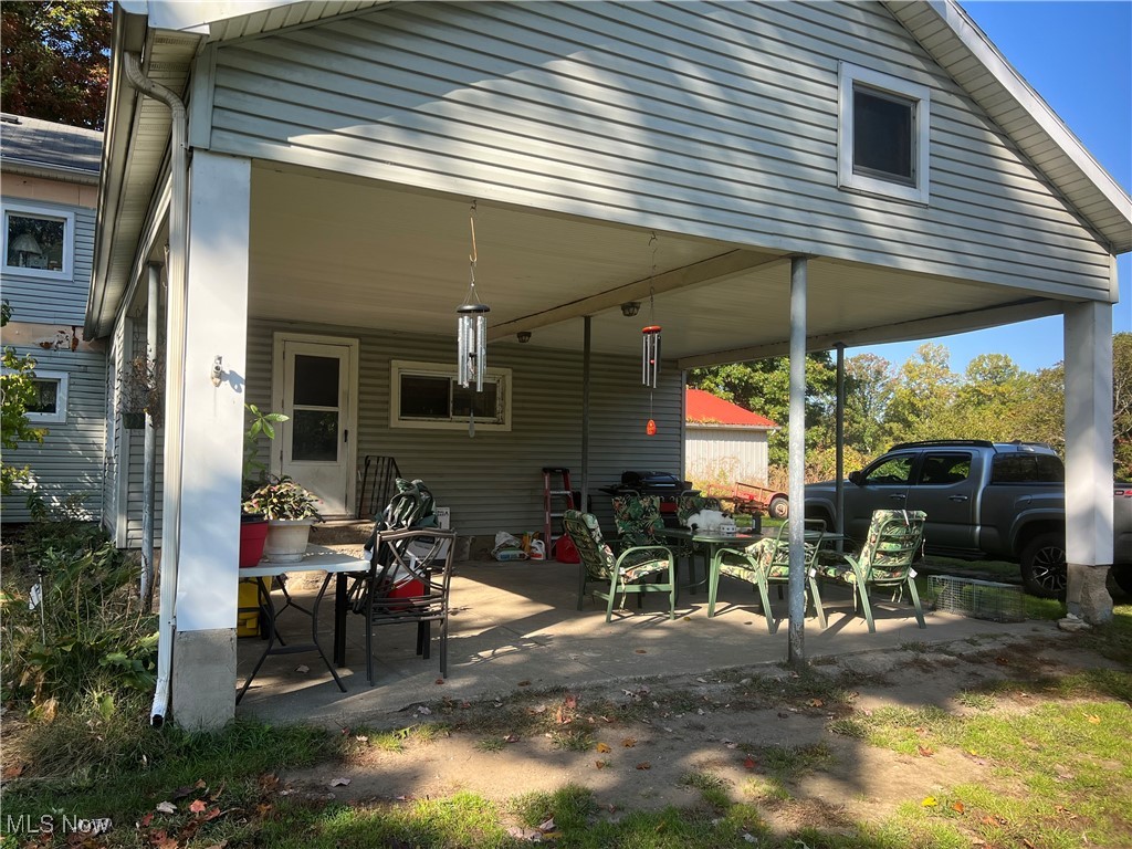 View of patio featuring a carport