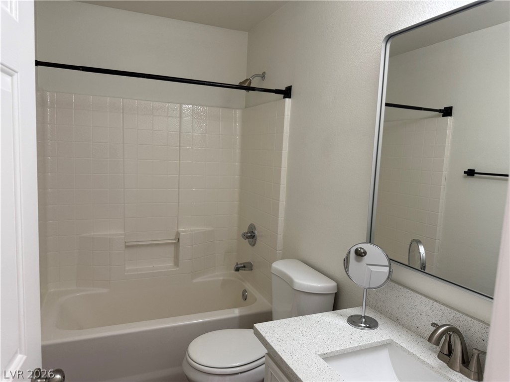 1141 Cathedral Ridge Street Henderson, NV 89052 - Photo 59 of 77 This bathroom features a sleek vanity and a combination shower-bathtub unit for convenience.