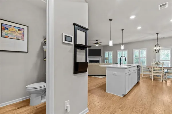 a large kitchen with a lot of counter space and a refrigerator