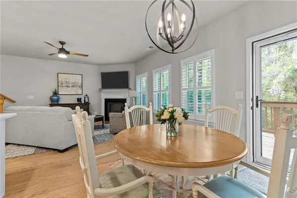 a dining room with furniture a livingroom and chandelier