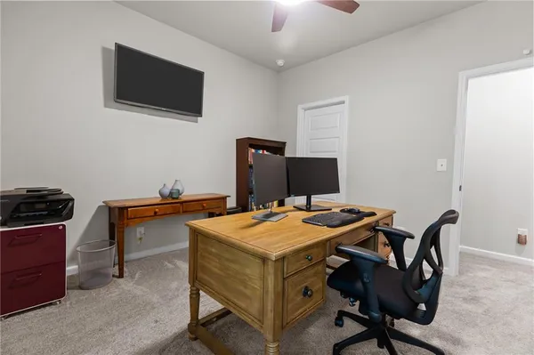 a view of a workspace with furniture