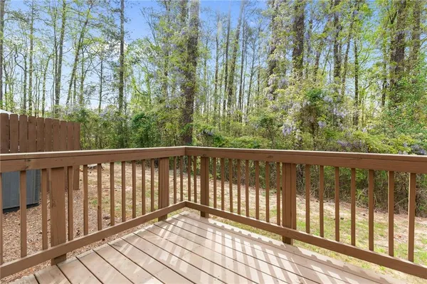 a view of a balcony with wooden floor