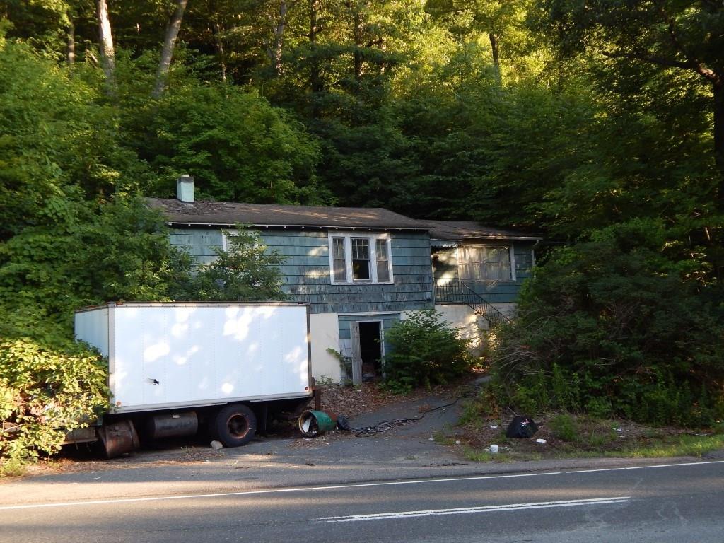 265 Frost Bridge Road Watertown, CT 06779 - Photo 1 of 1 an aerial view of a house with a garden and parking space