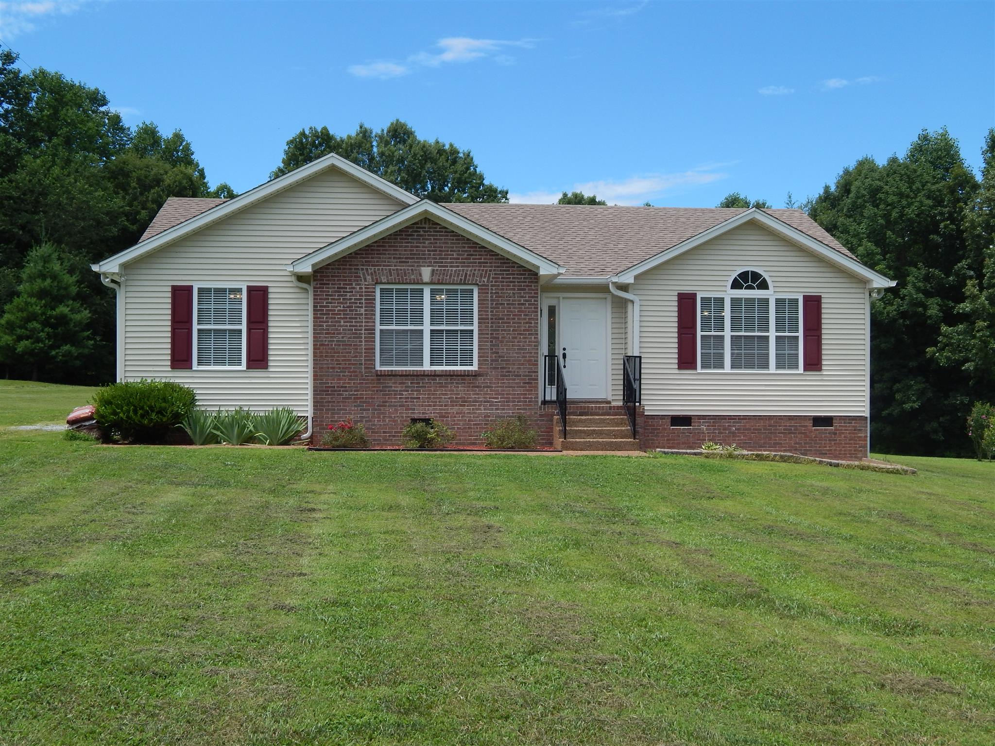 1533 Rapids Road Portland, TN 37148 - Photo 1 of 17 a front view of a house with a yard