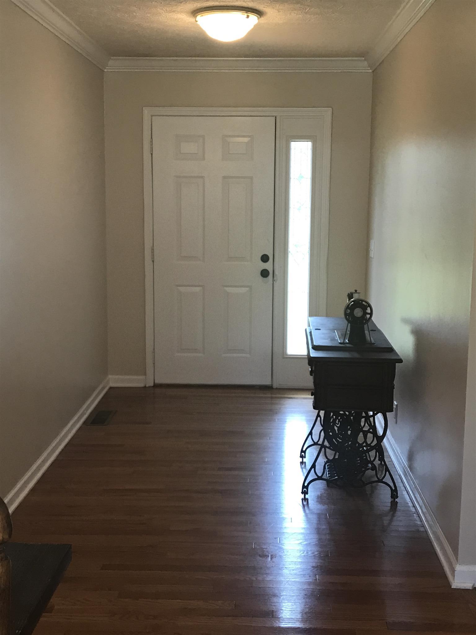 1533 Rapids Road Portland, TN 37148 - Photo 3 of 17 a view of empty room with wooden floor and lounge chair