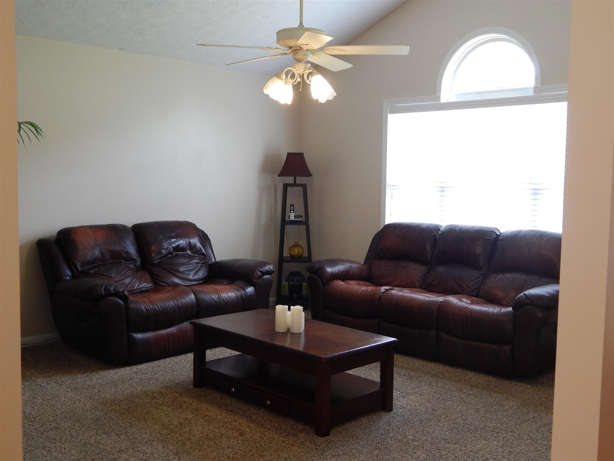 1533 Rapids Road Portland, TN 37148 - Photo 4 of 17 a living room with furniture a chandelier and a window