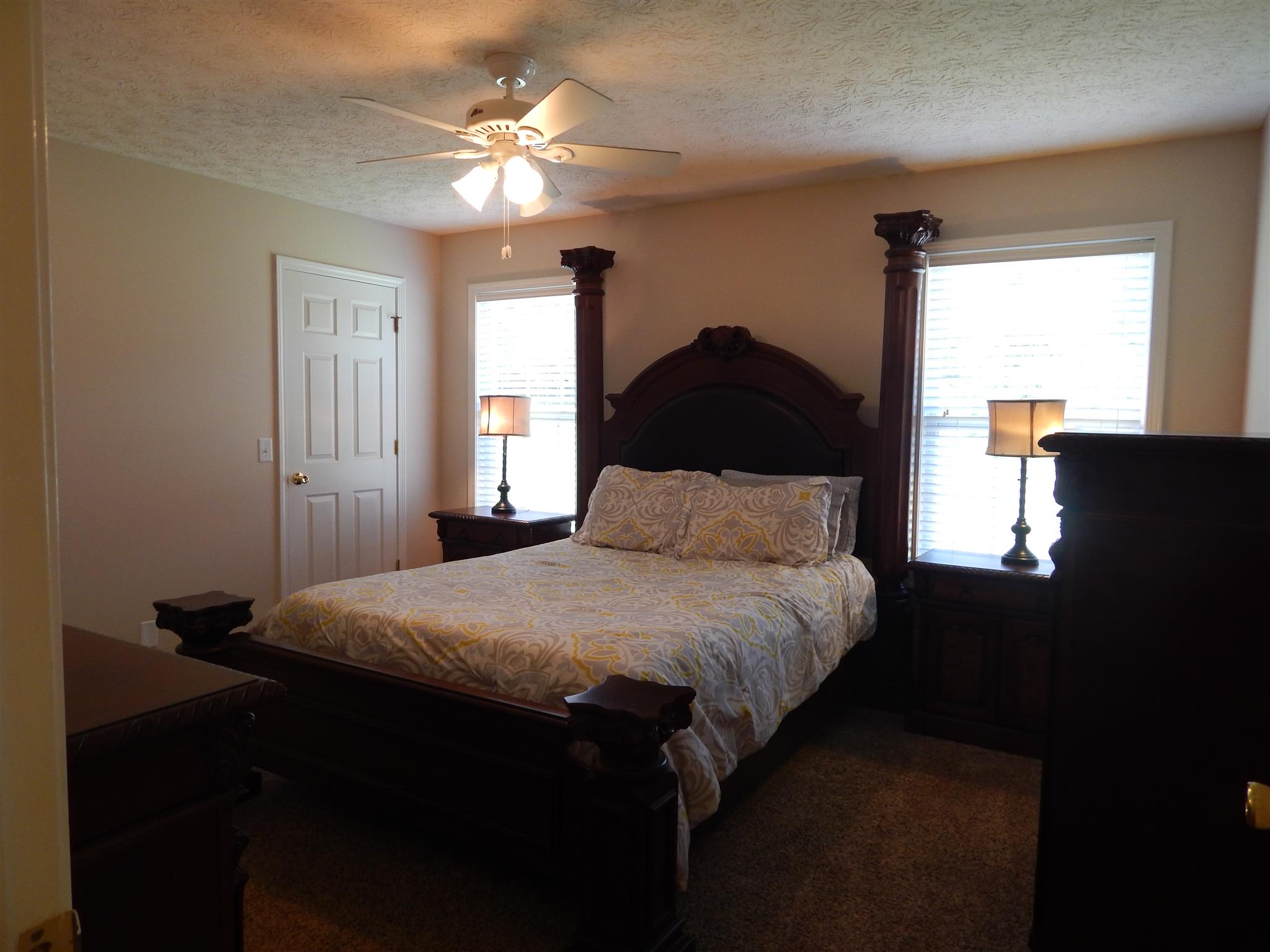 1533 Rapids Road Portland, TN 37148 - Photo 9 of 17 a bedroom with a bed and a chandelier