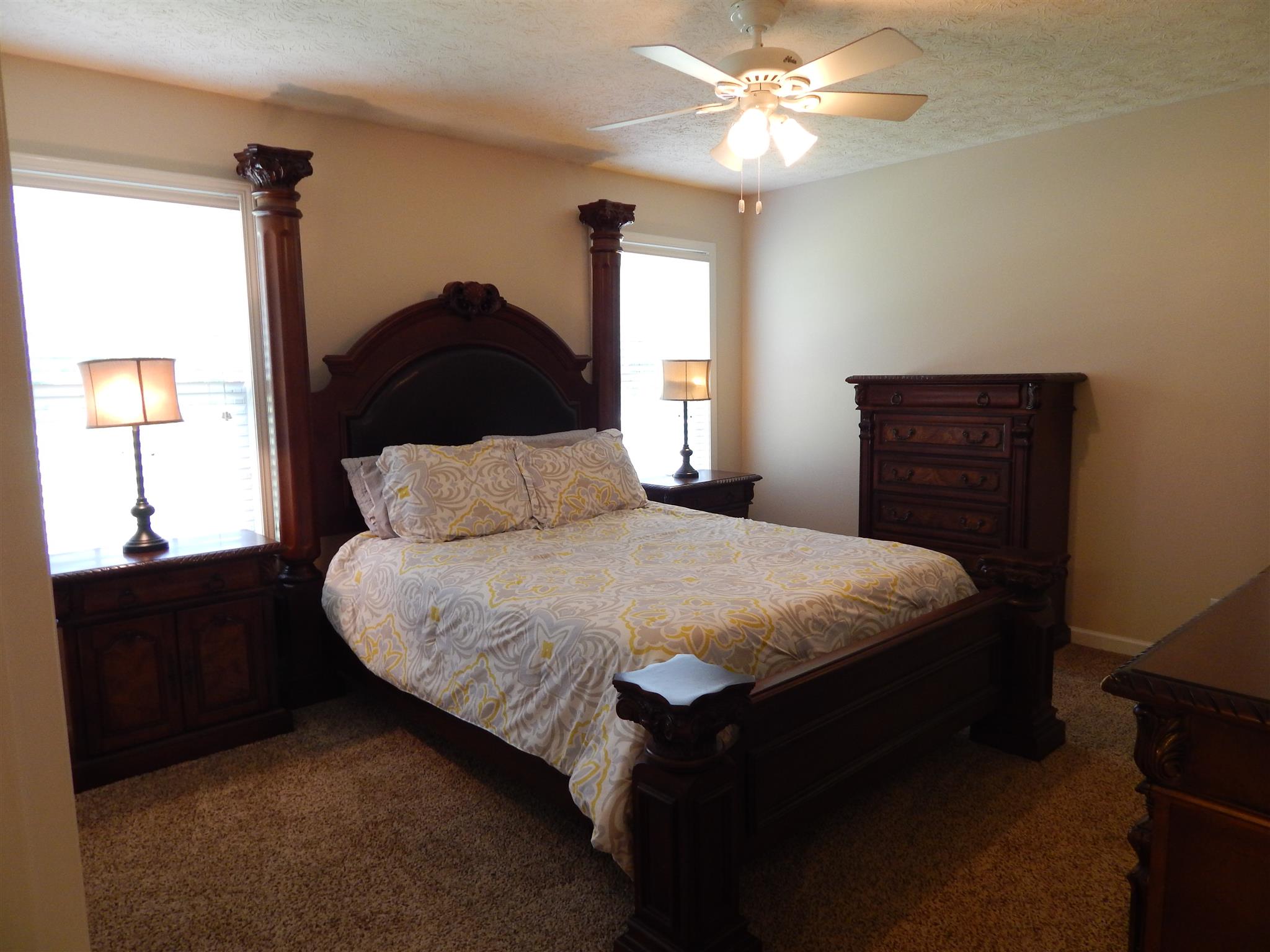 1533 Rapids Road Portland, TN 37148 - Photo 10 of 17 a bedroom with a bed and a chandelier