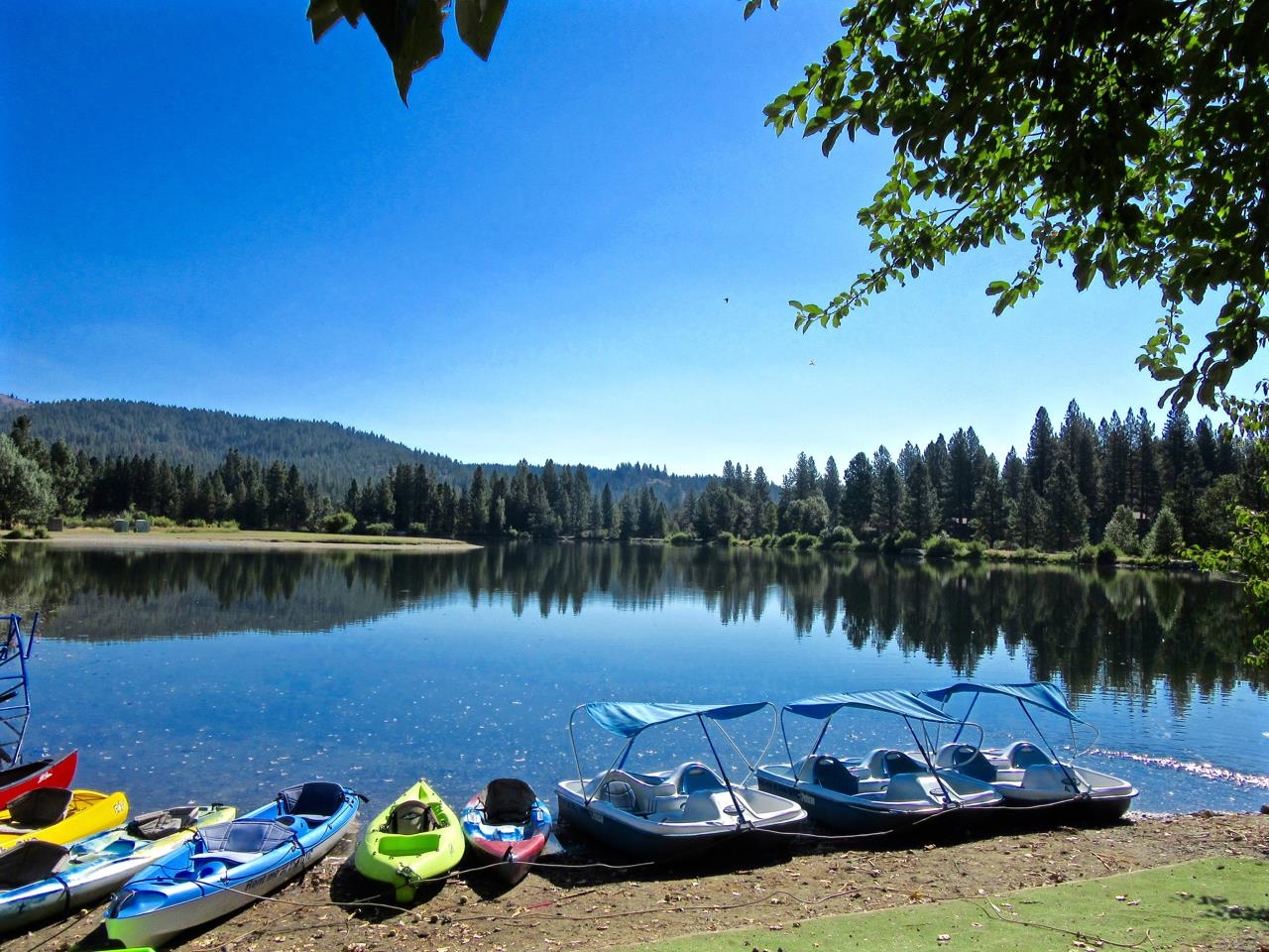 6 Pine Tree Court Blairsden, CA 96103 - Photo 18 of 22 a view of a lake with a table and chairs