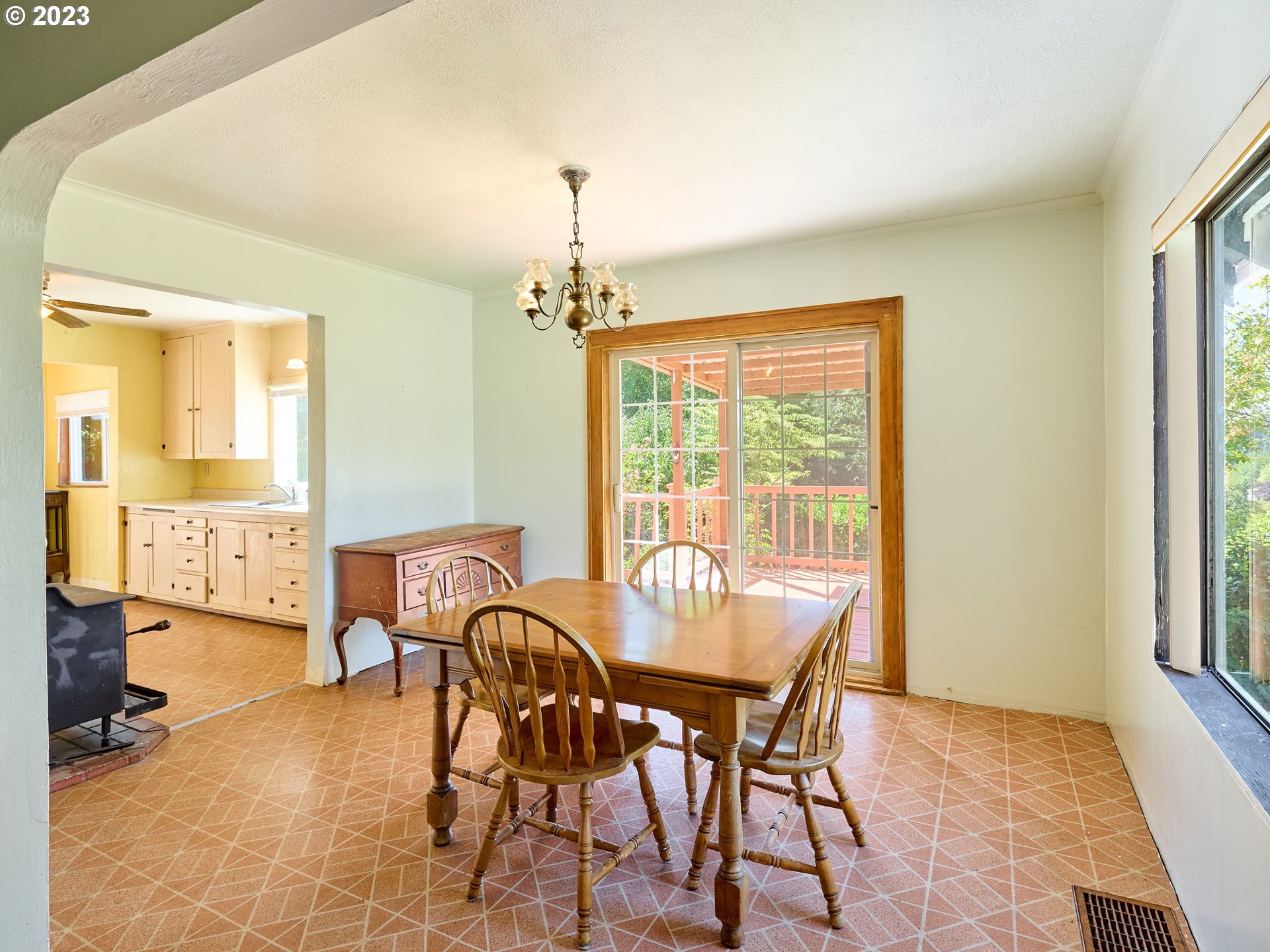 20140 Northeast Dopp Road Newberg, OR 97132 - Photo 19 of 46 a view of a dining room with furniture and chandelier