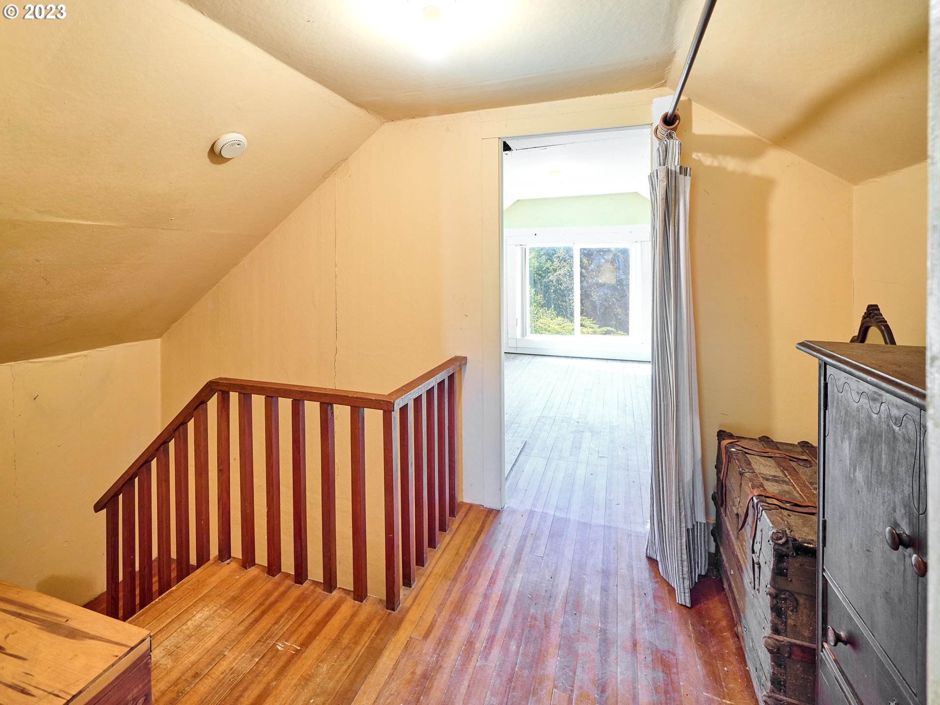 20140 Northeast Dopp Road Newberg, OR 97132 - Photo 27 of 46 a view of hallway with wooden floor and a flat screen tv