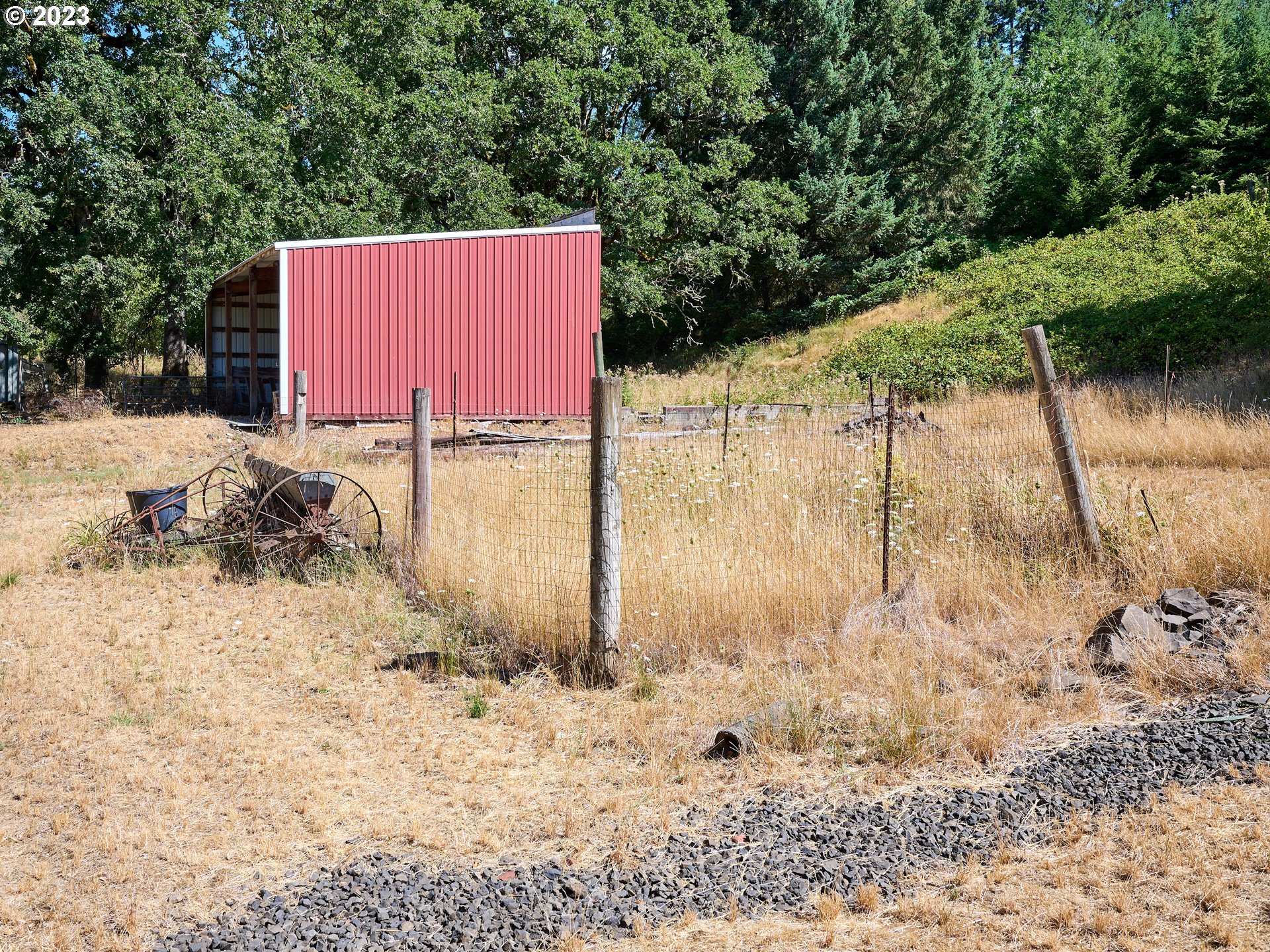 20140 Northeast Dopp Road Newberg, OR 97132 - Photo 32 of 46 a backyard of a house with a yard and garage