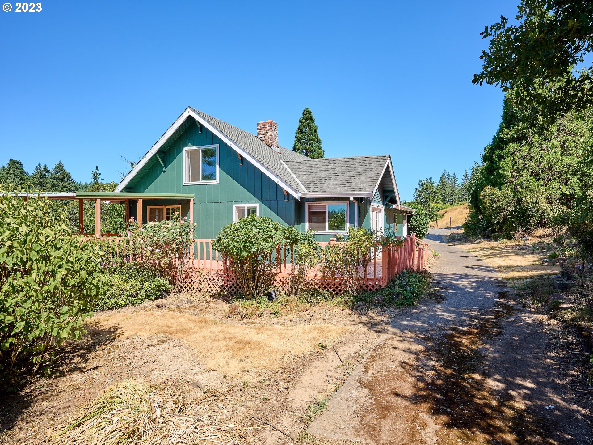 20140 Northeast Dopp Road Newberg, OR 97132 - Photo 6 of 46 a front view of a house with a yard