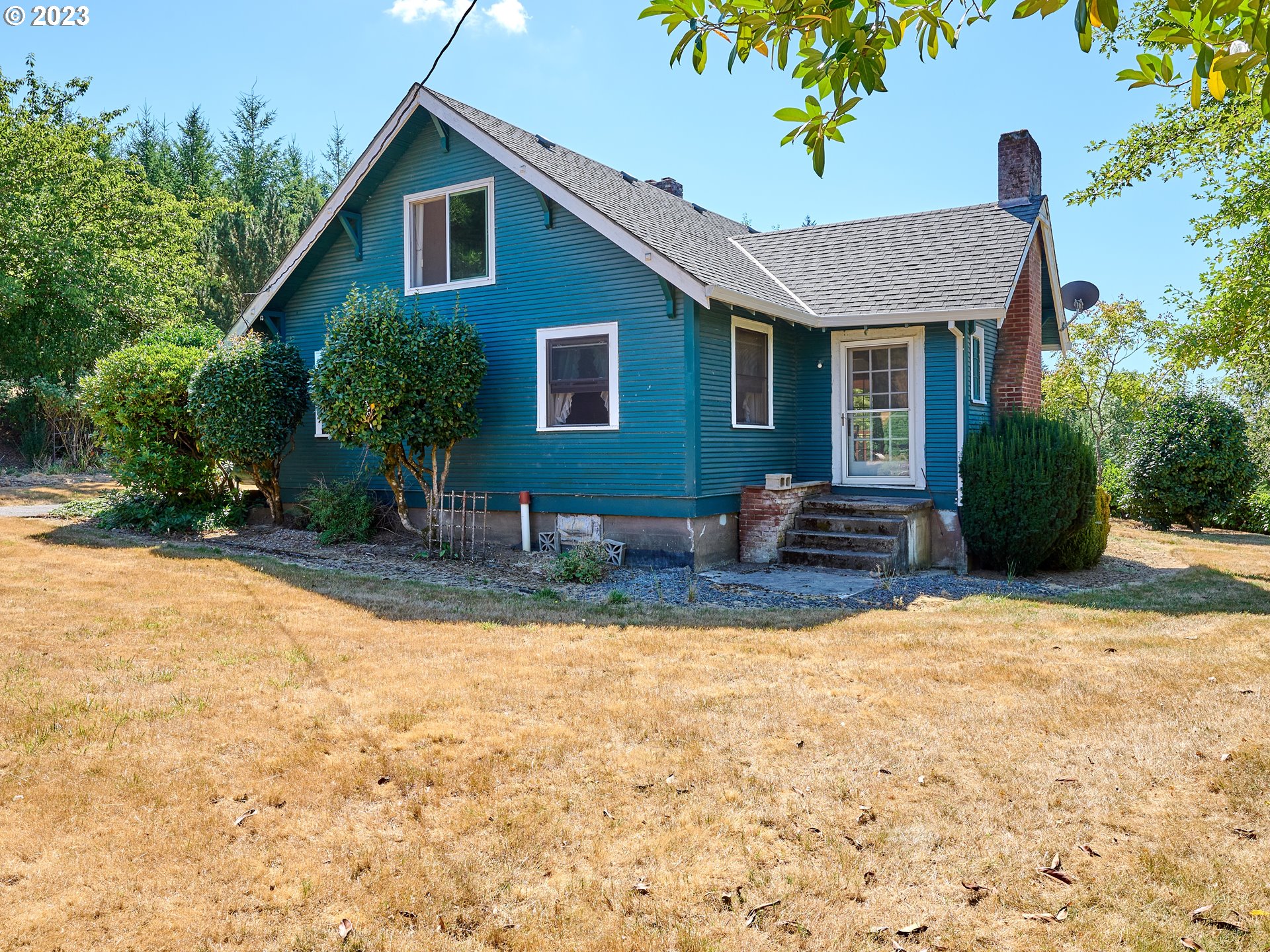 20140 Northeast Dopp Road Newberg, OR 97132 - Photo 10 of 46 a view of a house with swimming pool and sitting area
