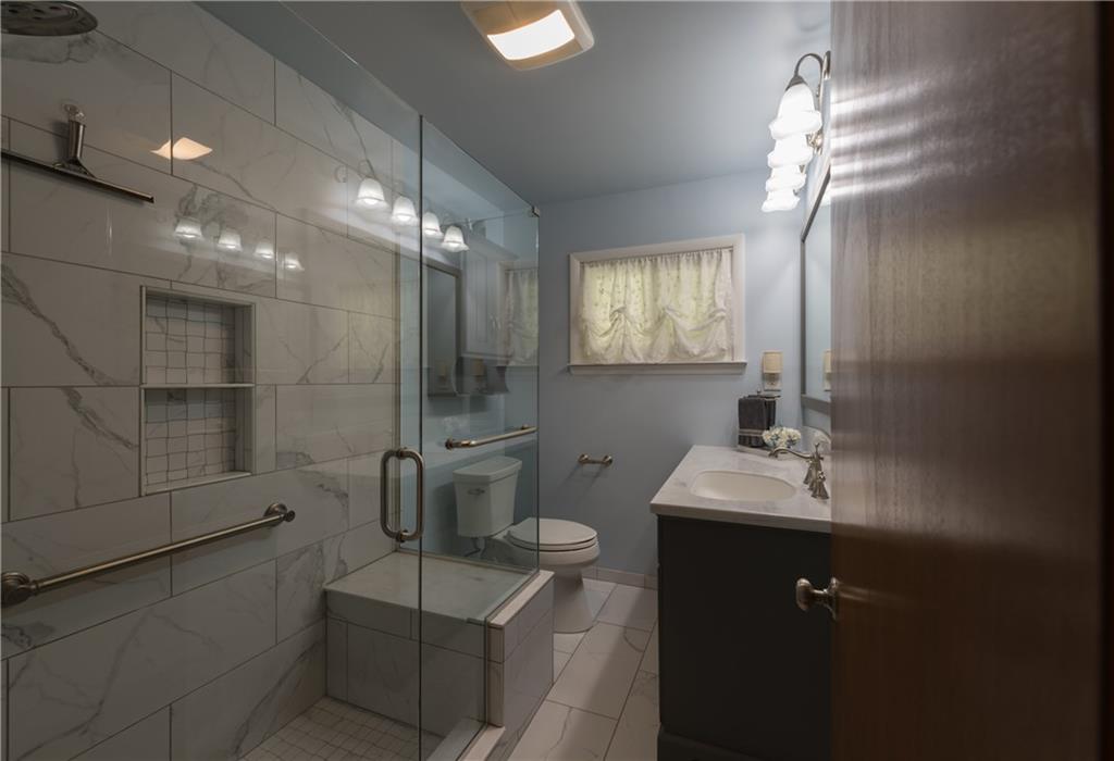 13 Weber Road Jeannette, PA 15644 - Photo 14 of 19 Custom Spa Like Main Bath ~ Corian Vanity, High End Fixtures & Designer Shower constructed with the WEDI Containment System.
