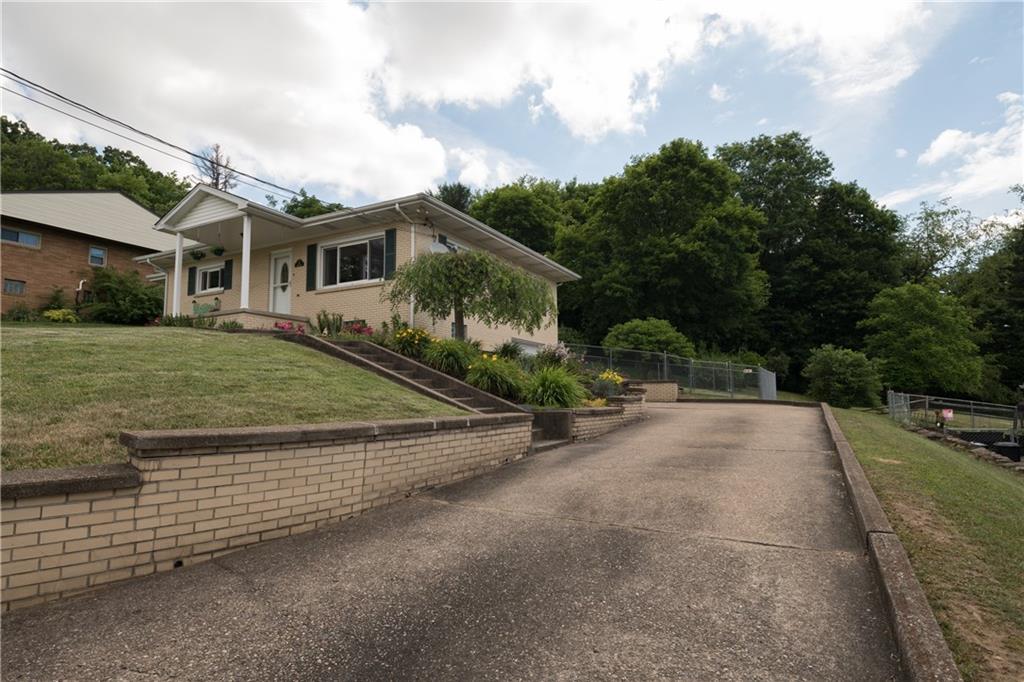 13 Weber Road Jeannette, PA 15644 - Photo 3 of 19 Concrete Driveway leading to garage. Space for several cars.