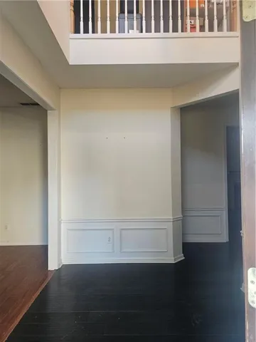 a view of a small space with wooden floor