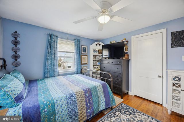 a bedroom with a bed and a television