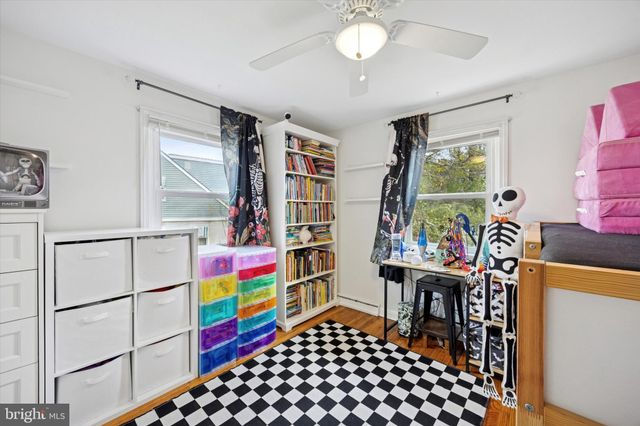 a room with furniture a rug and a window