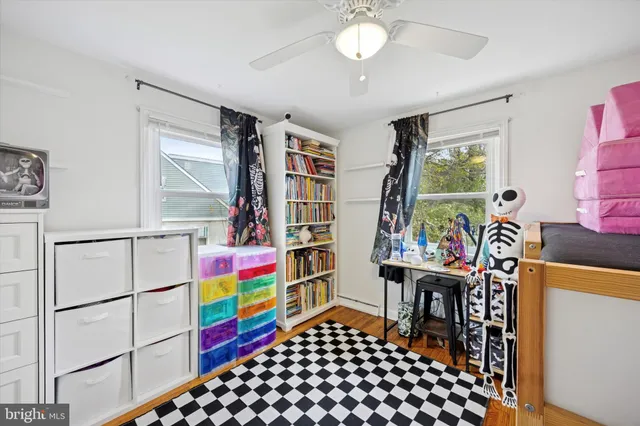a room with furniture a rug and a window