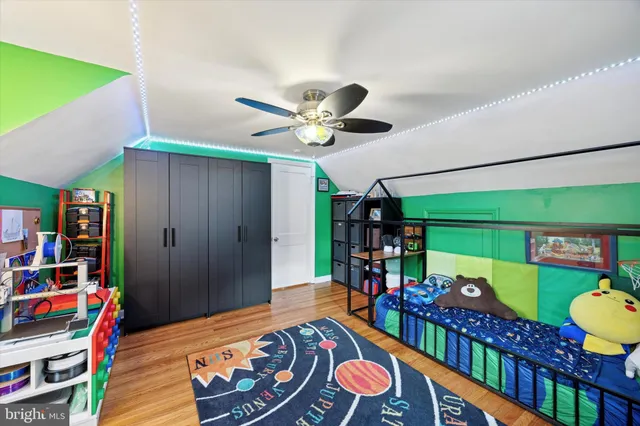 a living room with lots of furniture and baby bed