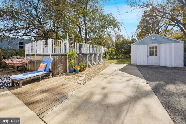 a view of a backyard with sitting area