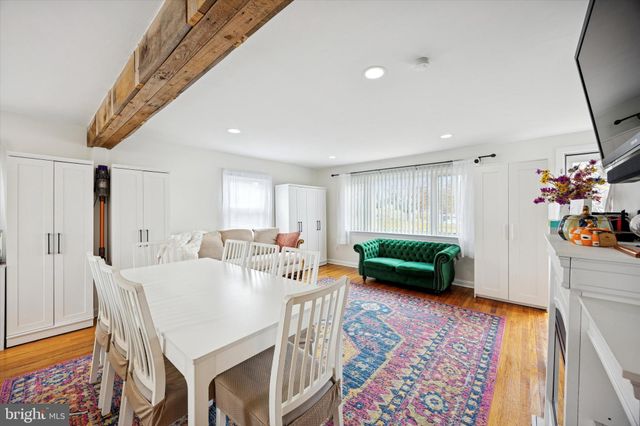 a living room with furniture and a rug
