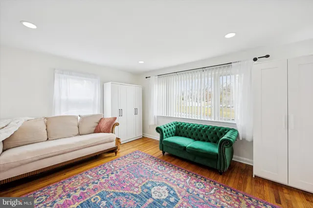a living room with furniture and a rug