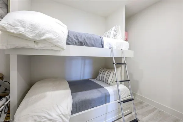 a bathroom with a shower sink vanity mirror and toilet