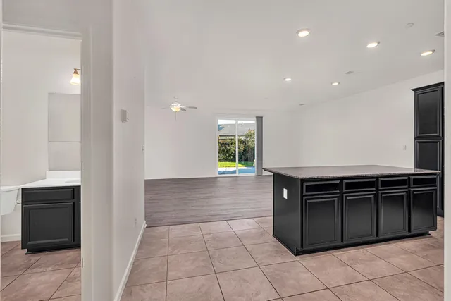 a bathroom with a sink a toilet a mirror and shower