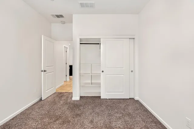 a kitchen with stainless steel appliances granite countertop a sink a stove and refrigerator