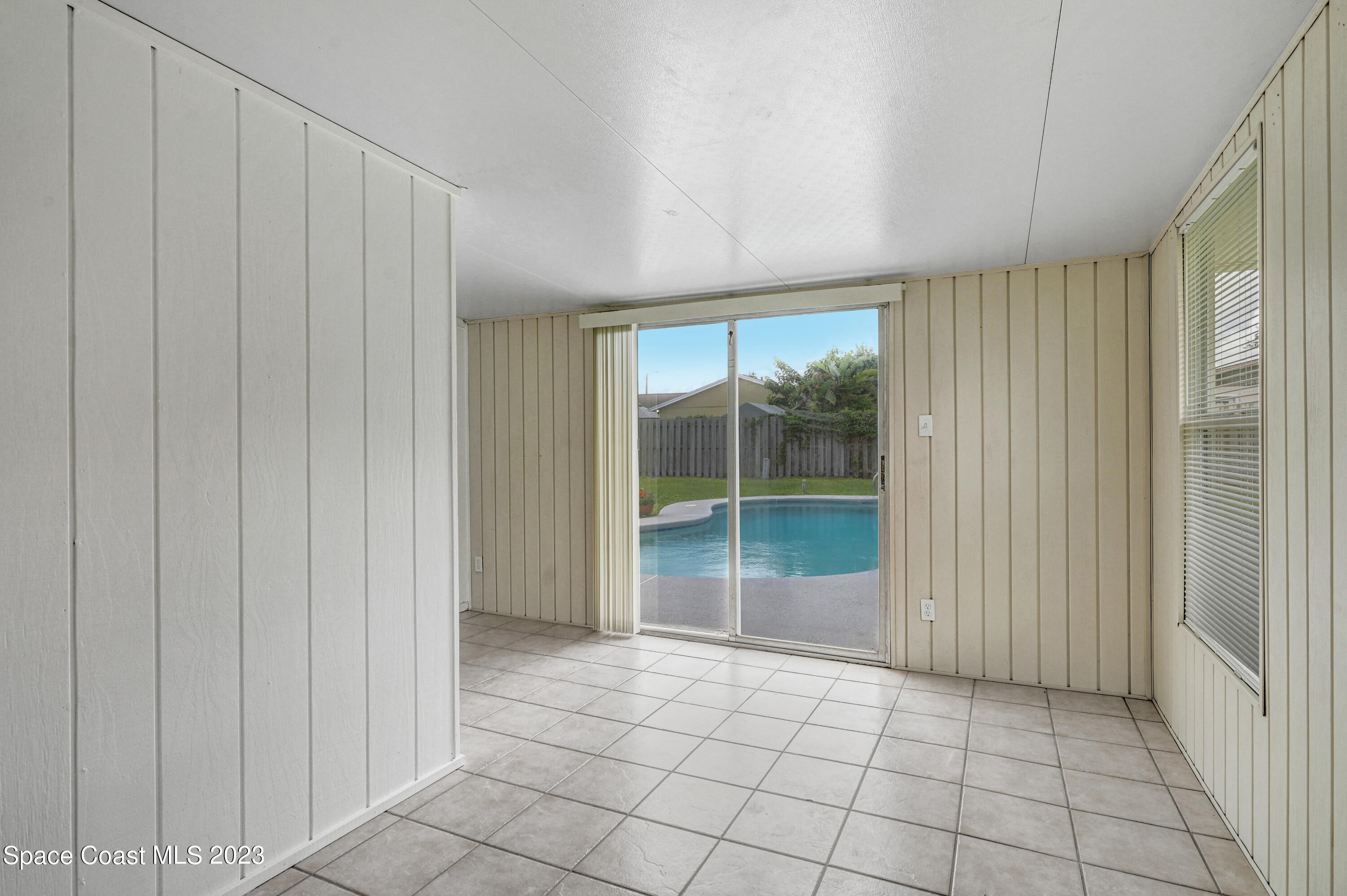 2781 Hereford Road Melbourne, FL 32935 - Photo 12 of 33 a view of an empty room with window and cabinet
