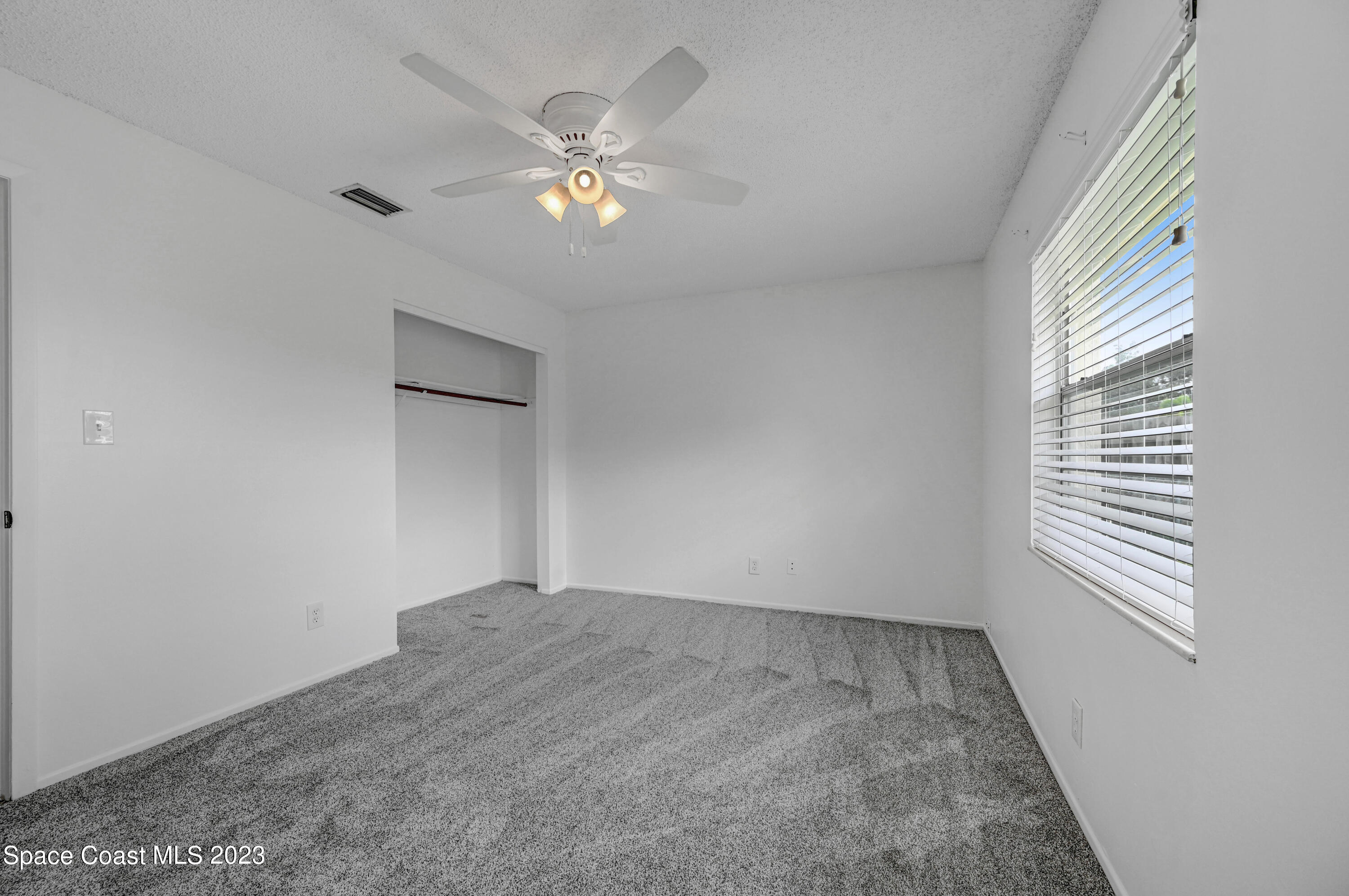 2781 Hereford Road Melbourne, FL 32935 - Photo 21 of 33 a view of an empty room with a window