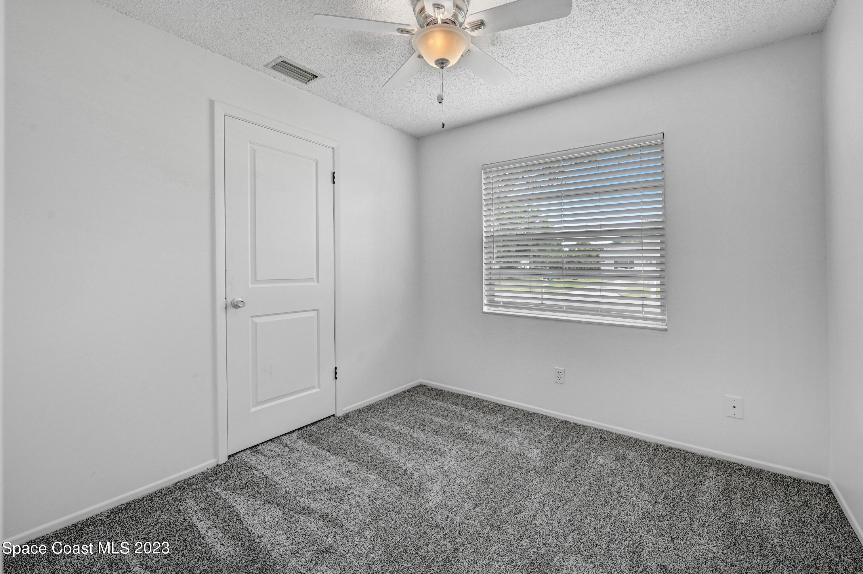 2781 Hereford Road Melbourne, FL 32935 - Photo 24 of 33 a view of an empty room with a window