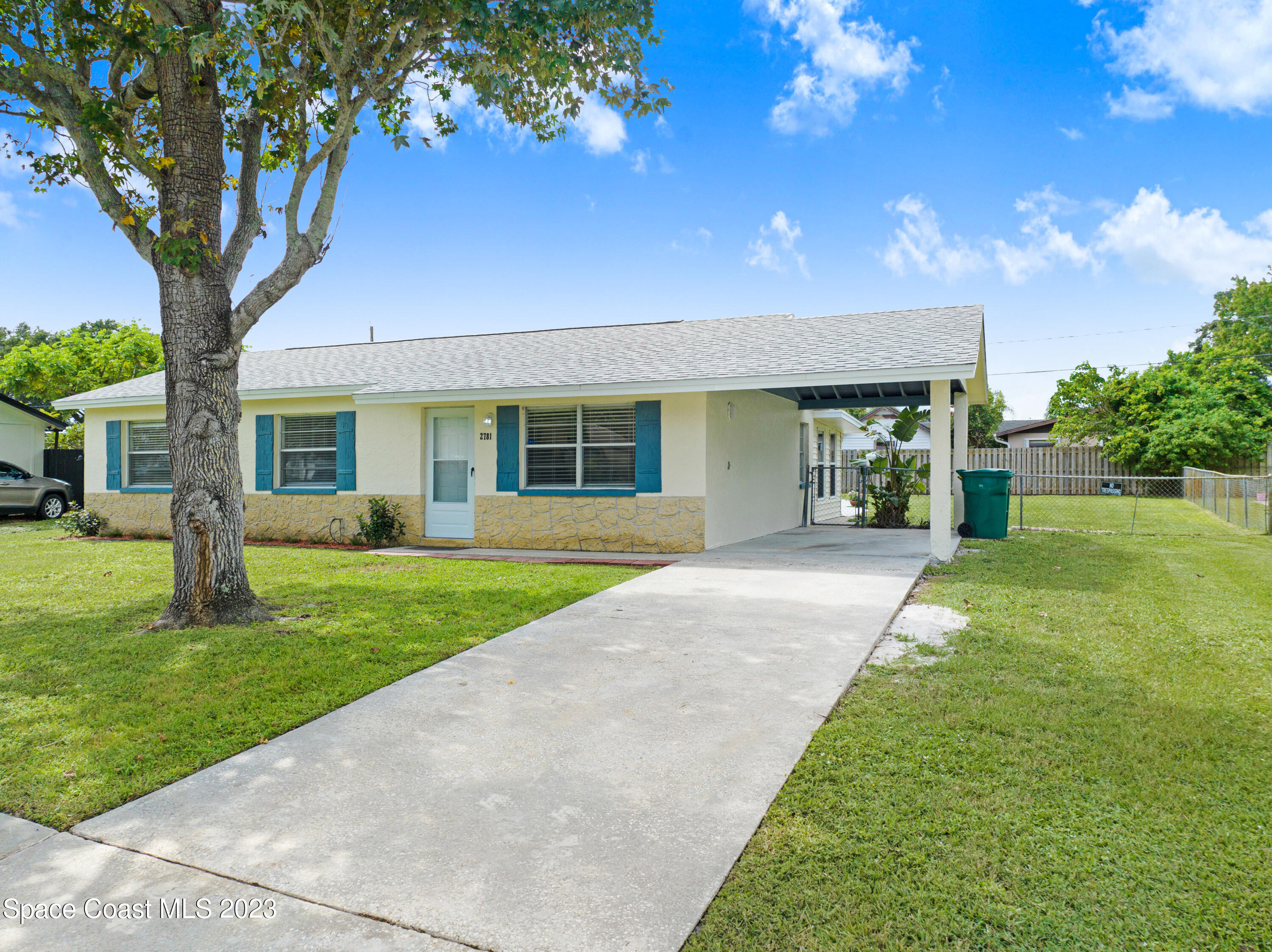 2781 Hereford Road Melbourne, FL 32935 - Photo 25 of 33 a view of a house with a yard