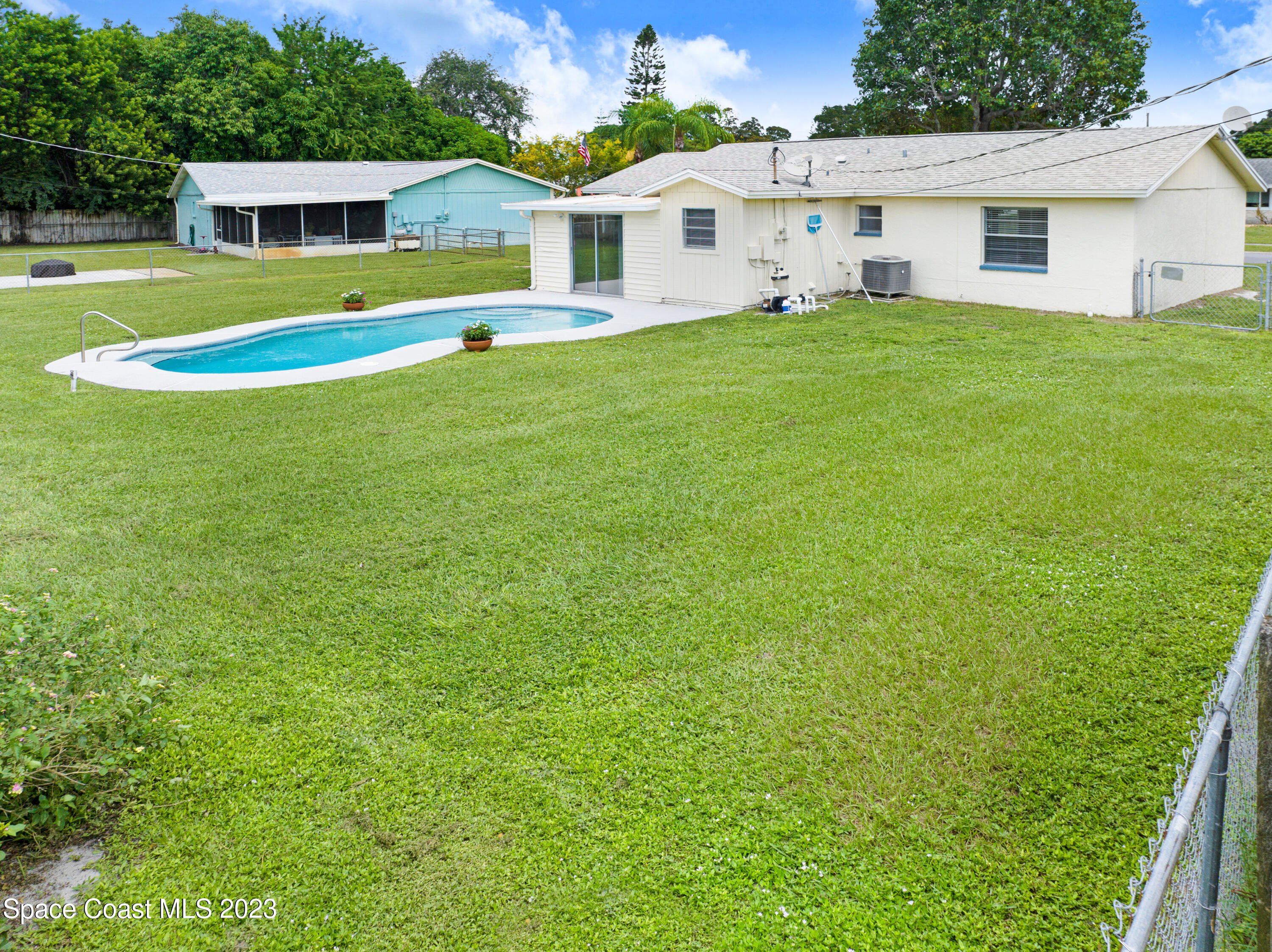 2781 Hereford Road Melbourne, FL 32935 - Photo 30 of 33 a view of a house with a backyard