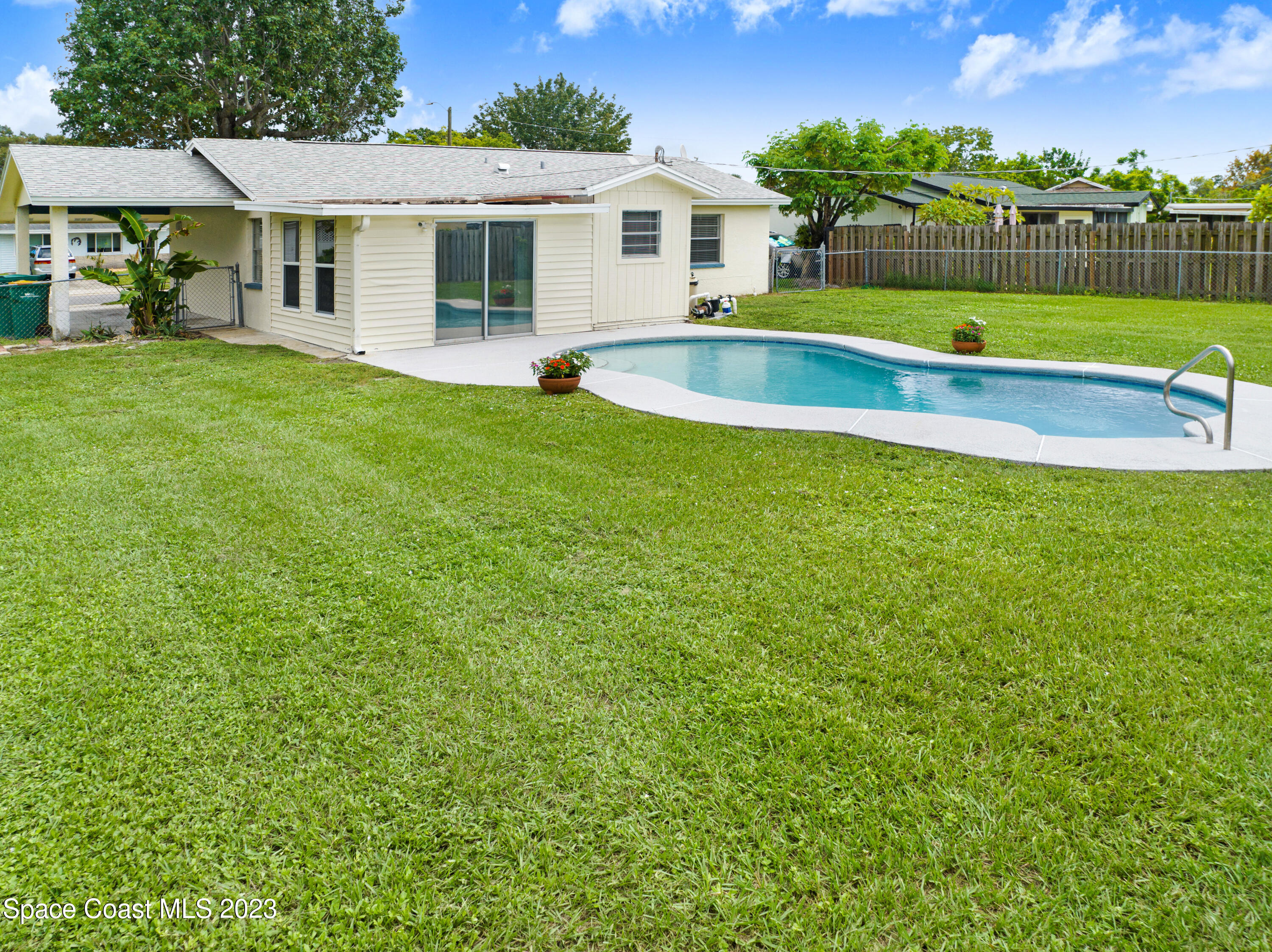 2781 Hereford Road Melbourne, FL 32935 - Photo 32 of 33 a view of a house with a yard and sitting area