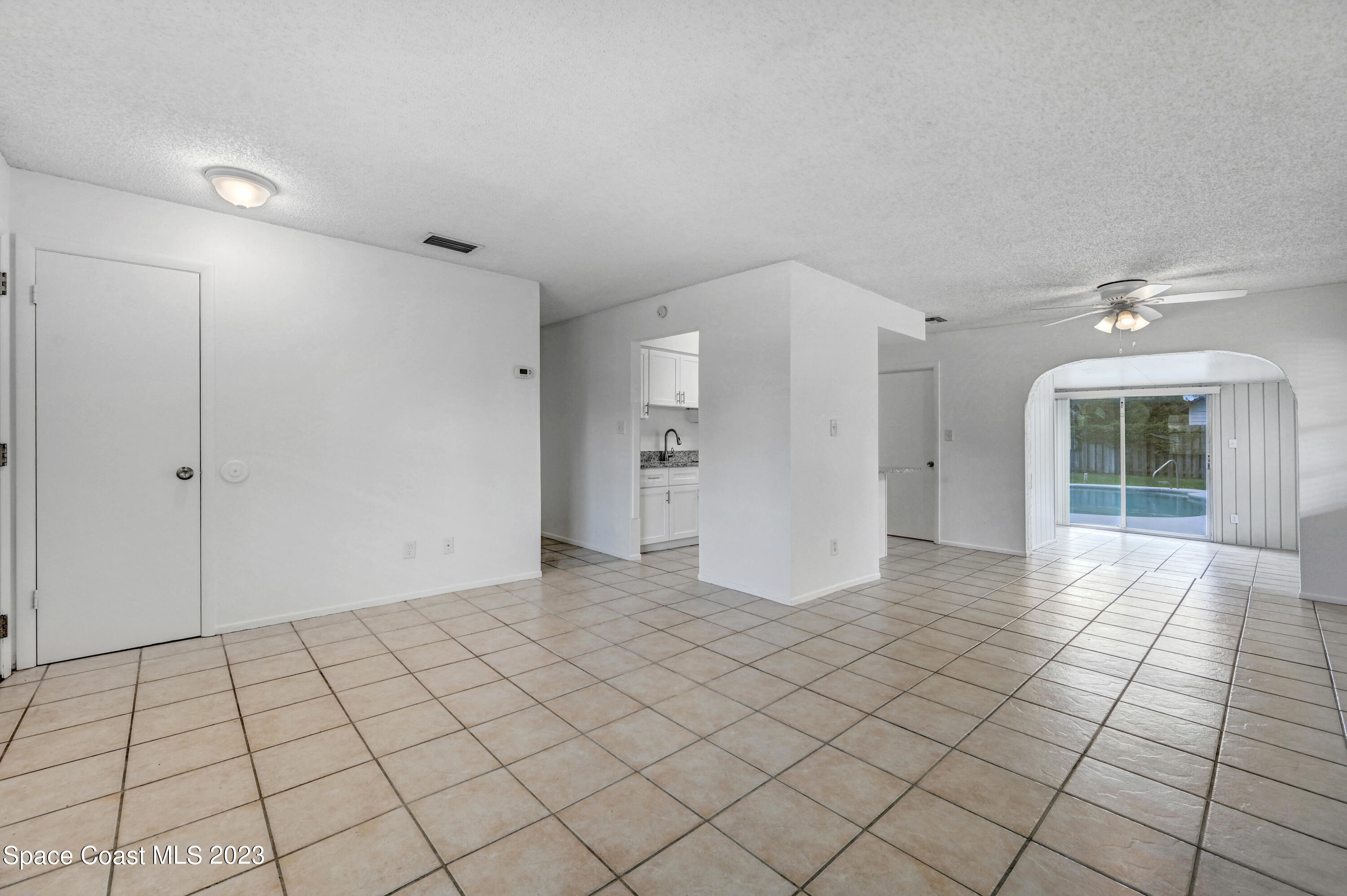 2781 Hereford Road Melbourne, FL 32935 - Photo 7 of 33 a view of an empty room and window