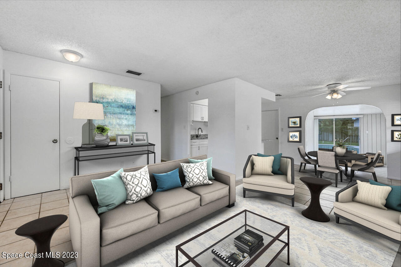 2781 Hereford Road Melbourne, FL 32935 - Photo 8 of 33 a living room with furniture and a couch