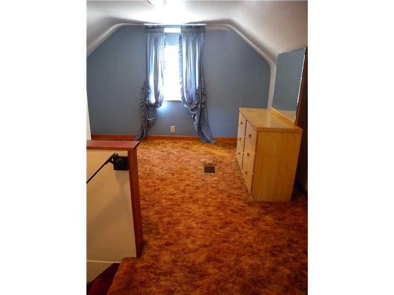1104 Brinton Road Braddock Hills, PA 15221 - Photo 16 of 20 Interior Space/Layout. Stairway from 1st floor into great space for office, den or workspace~Wood flooring beneath carpeting~