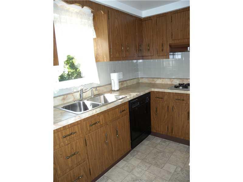 1104 Brinton Road Braddock Hills, PA 15221 - Photo 4 of 20 Kitchen. Ample counter space~Backsplash~Ample cabinetry~Double stainless sink~Imagine cooking your favorite meals in this remarkable kitchen~