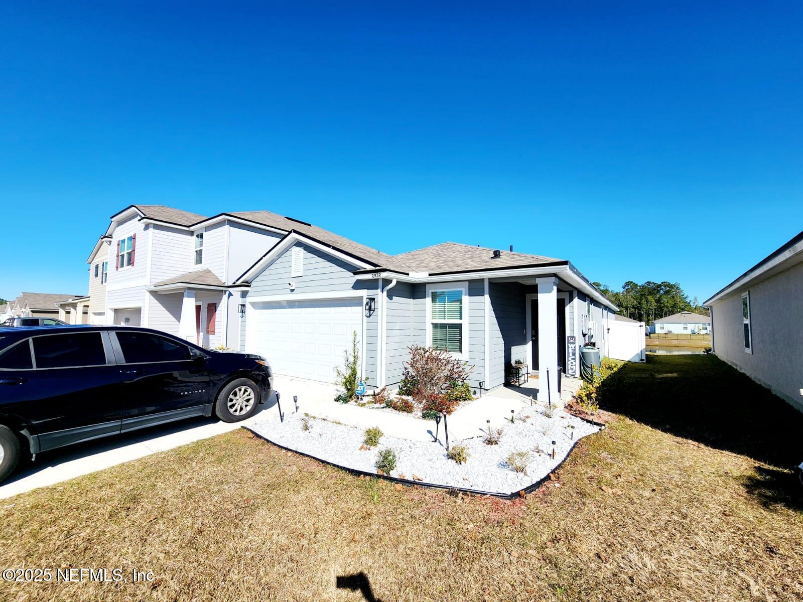 a view of a car parked in front of a house